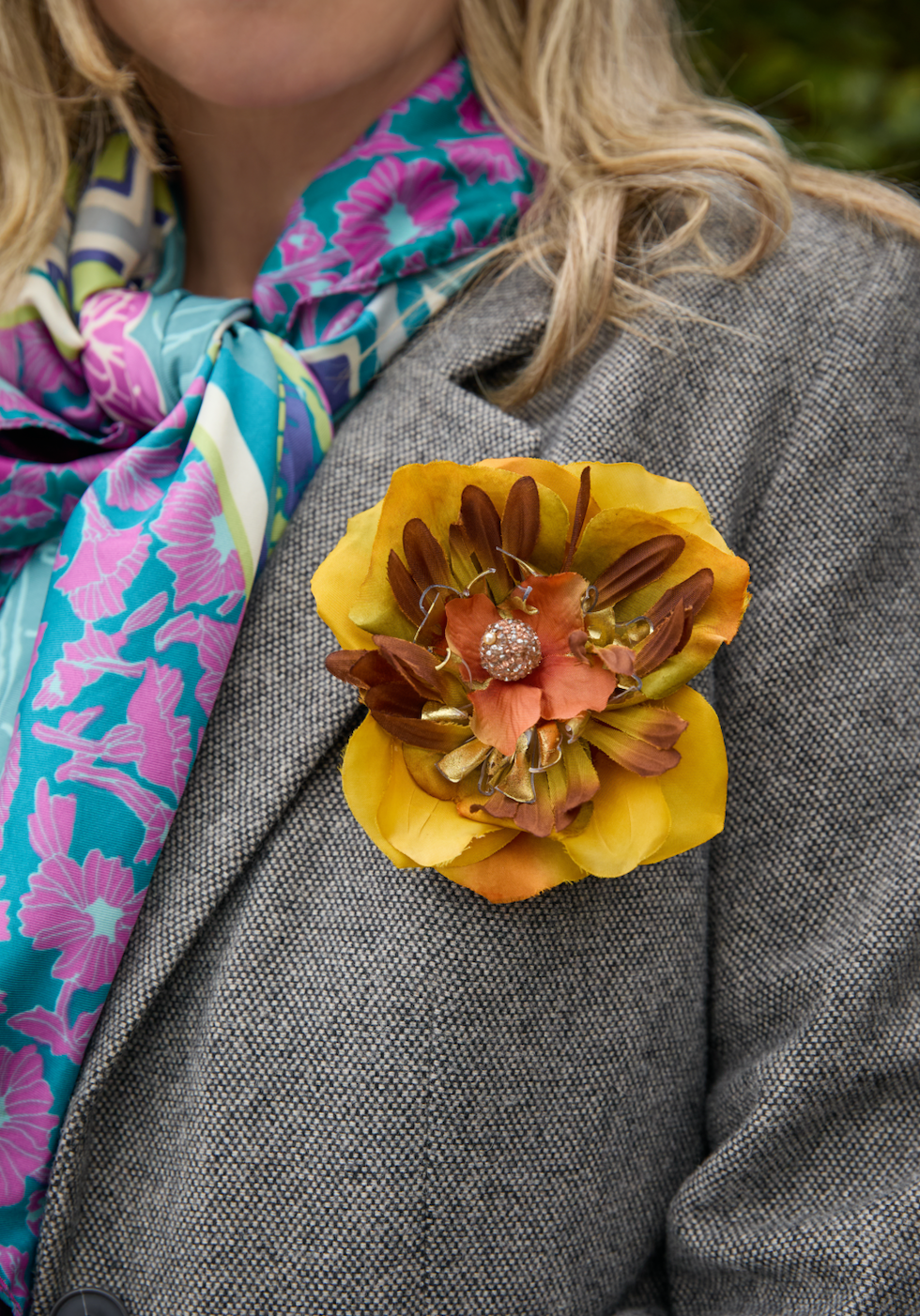 Tonal saffron colored floral brooch